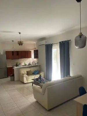 a living room with a couch and a table at Tzitzifianaki apartment in Chania Town