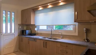 a kitchen with a sink and a window at Archontissa Kakodiki - Paleochora in Áyioi Theódhoroi