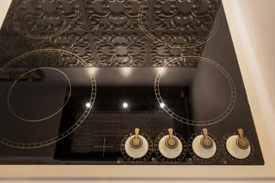 a group of clocks on a wall with lights at il Campanile Luxury Living in Chania Town