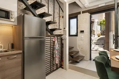 a kitchen with a stainless steel refrigerator at Lovelia Maisonette Chania in Chania Town