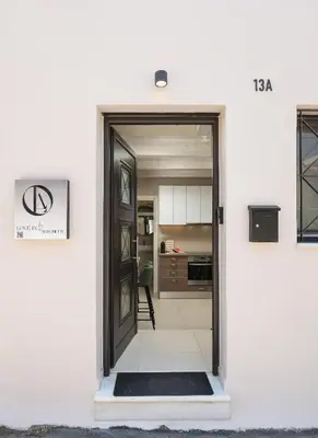 a door leading into a kitchen with a room at Lovelia Maisonette Chania in Chania Town