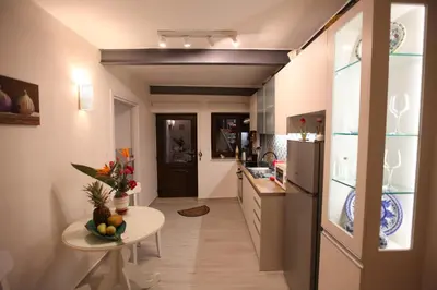 a kitchen with a table and a counter top at Kabanas suite 1 in Chania Town