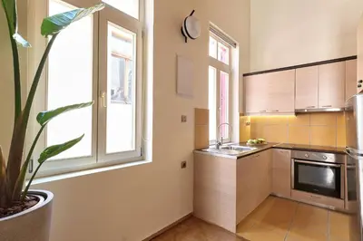 a kitchen with a sink and a window and a plant at Filomeli Estate in Chania Town