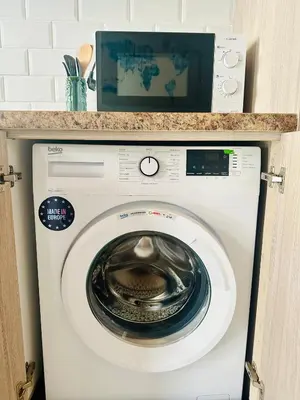 a washing machine with a counter on top of it at Julia's cottage in Kalyves