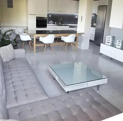 a living room with a couch and a table and chairs at blue and green II in Chania Town
