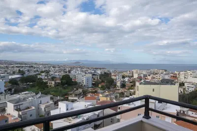 a view of a city from a balcony at SunShine studio in Chania Town