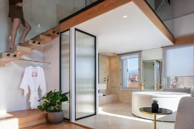 a bathroom with a bath tub and a sink at La Torre Residenza Imperiale in Chania Town