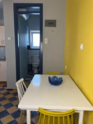 a white table with a bowl on it in a room at Pink House 2 in Palaiochóra