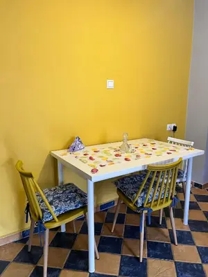 a table and two chairs in a room at Pink House 2 in Palaiochóra