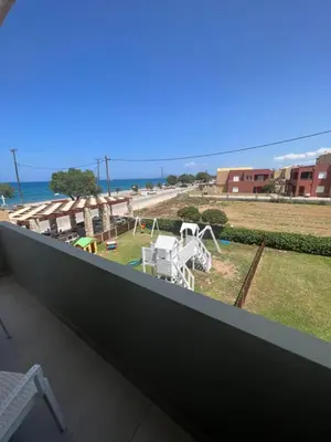 a balcony with a view of the ocean at wave rooms sea view in Maleme