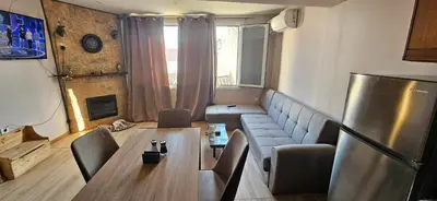 a living room with a couch and a table at 4Seasons in Chania Town