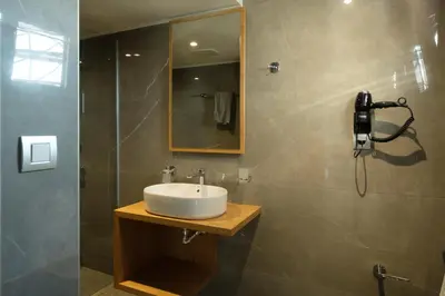 a bathroom with a sink and a shower at Sky-High Central Penthouse w. Stunning Views - 03 in Chania Town