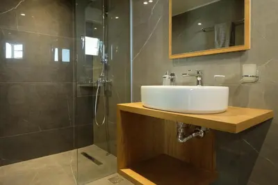 a bathroom with a sink and a shower at Sky-High Central Penthouse w. Stunning Views - 03 in Chania Town