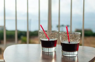 two glasses of soda sitting on a table at The Rock *Peaceful Retreat House in Kámbos