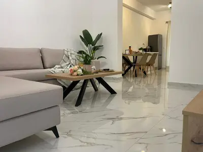 a living room with a couch and a table at SK Luxury Residence in Chania Town