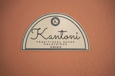 a sign for a karnium traditional house markings at Kantoni traditional house in Maláthiros