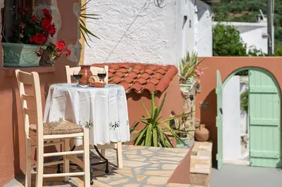 a table and chairs sitting on a patio at Kantoni traditional house in Maláthiros