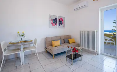 a living room with a couch and a table at Casa Di Halepa in Chania Town