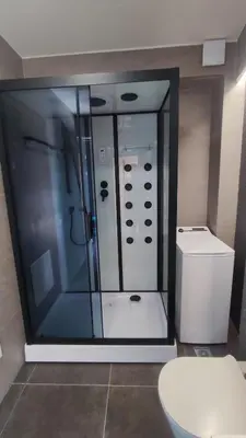a bathroom with a shower and a toilet at Summertime Signature Suites in Agia Marina Nea Kydonias