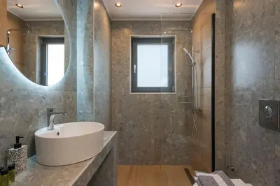a bathroom with a sink and a shower at Aspect Luxury Apartments with Pool in Galangádhos