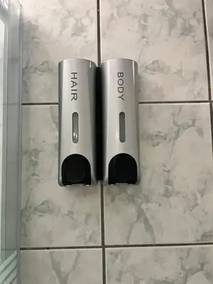 twointendo wii controllers sitting on a tiled floor at Dream Apartments in Palaiochóra