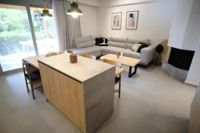 a living room with a couch and a table at GREEN ESTATE villas in Arménoi