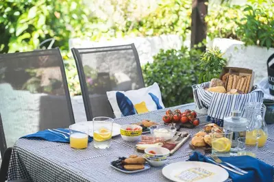 a table with breakfast foods and drinks on it at Labyrinth. The Wild life of Crete in Katsifarianá