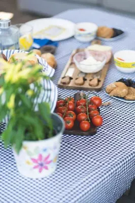 a table with tomatoes and other foods on it at Labyrinth. The Wild life of Crete in Katsifarianá