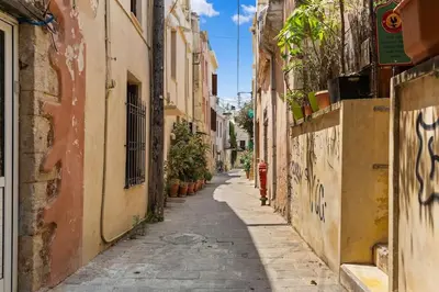 an alley in an old town with buildings at Rodon maisonette in Chania Town