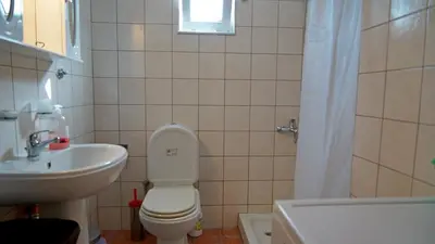 a bathroom with a toilet and a sink at Polyraki's Cottage in Chania Town