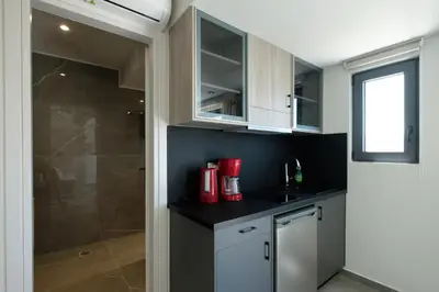 a kitchen with a sink and a shower at Sky-High Central Penthouse w. Stunning Views - 02 in Chania Town