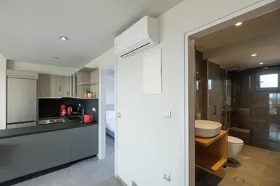 a bathroom with a sink and a toilet in a room at Sky-High 70sqm Penthouse w. Stunning Views - 05 in Chania Town