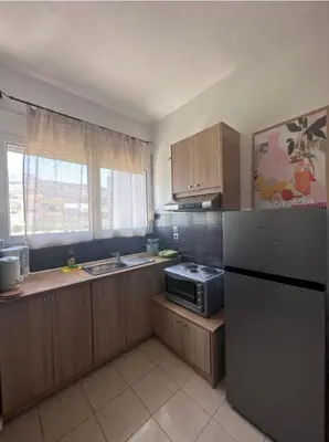 a kitchen with a refrigerator and a sink at Nova Marine in Souda