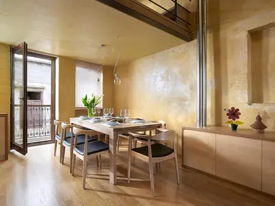 a dining room with a wooden table and chairs at Dorotheou House in Chania Town