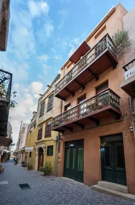 a building with balconies on the side of a street at Dorotheou House in Chania Town