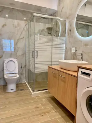 a bathroom with a toilet and a sink and a shower at Paleochora Beach Studio (BRAND NEW) in Palaiochóra