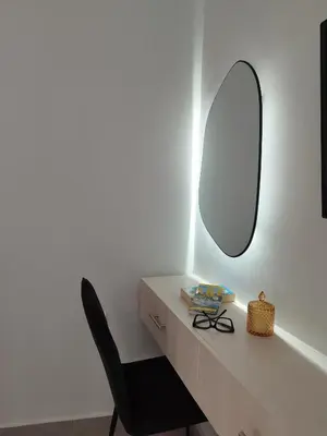 a desk with a chair and a mirror at Villa Katerina in Chania Town