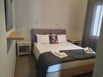 a bedroom with a bed with towels on it at Villa Katerina in Chania Town