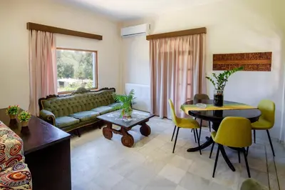 a living room with a couch and a table at Villa Thalia Chania in Chania Town