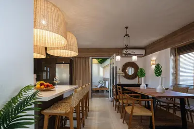 a dining room with a long table and chairs at JW luxury apartment in Chania Town