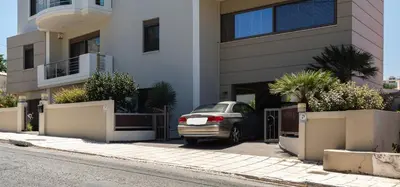 a car parked in front of a building at JW luxury apartment in Chania Town
