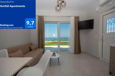 a living room with a couch and a table at Korfali Apartments in Kissamos