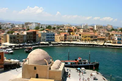 a view of a city with a boat in the water at Dorothy's Dream in Chania Town