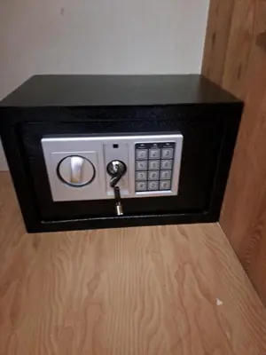 a microwave with a key in a black box at Parthenon apartment in Souda