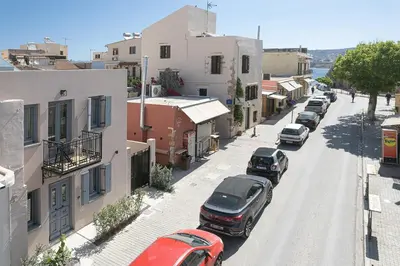 a city street with cars parked on the street at La Canea Living in Chania Town