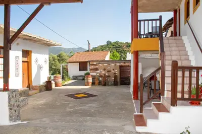 a courtyard of a house with a garage at Anastasia Country Home in Strovlés