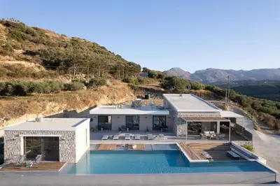 a house with a swimming pool on top of a hill at Magical new luxury villa Camellia! in Kissamos