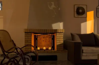 a living room with a brick fireplace with a couch at Searenity Home in Ropanianá