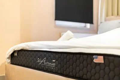 a bed with a television on top of it at Boutique house Romantza in Kallithea-Voukolies