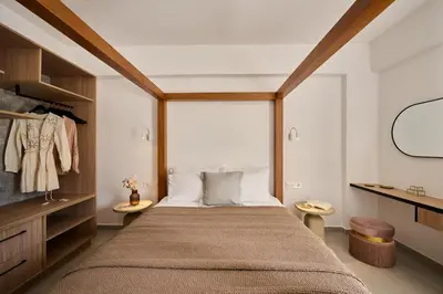 a bedroom with a large bed and a window at Kyamon Luxury Villa with Heated Saltwater Pool Near Chania in Chania Town